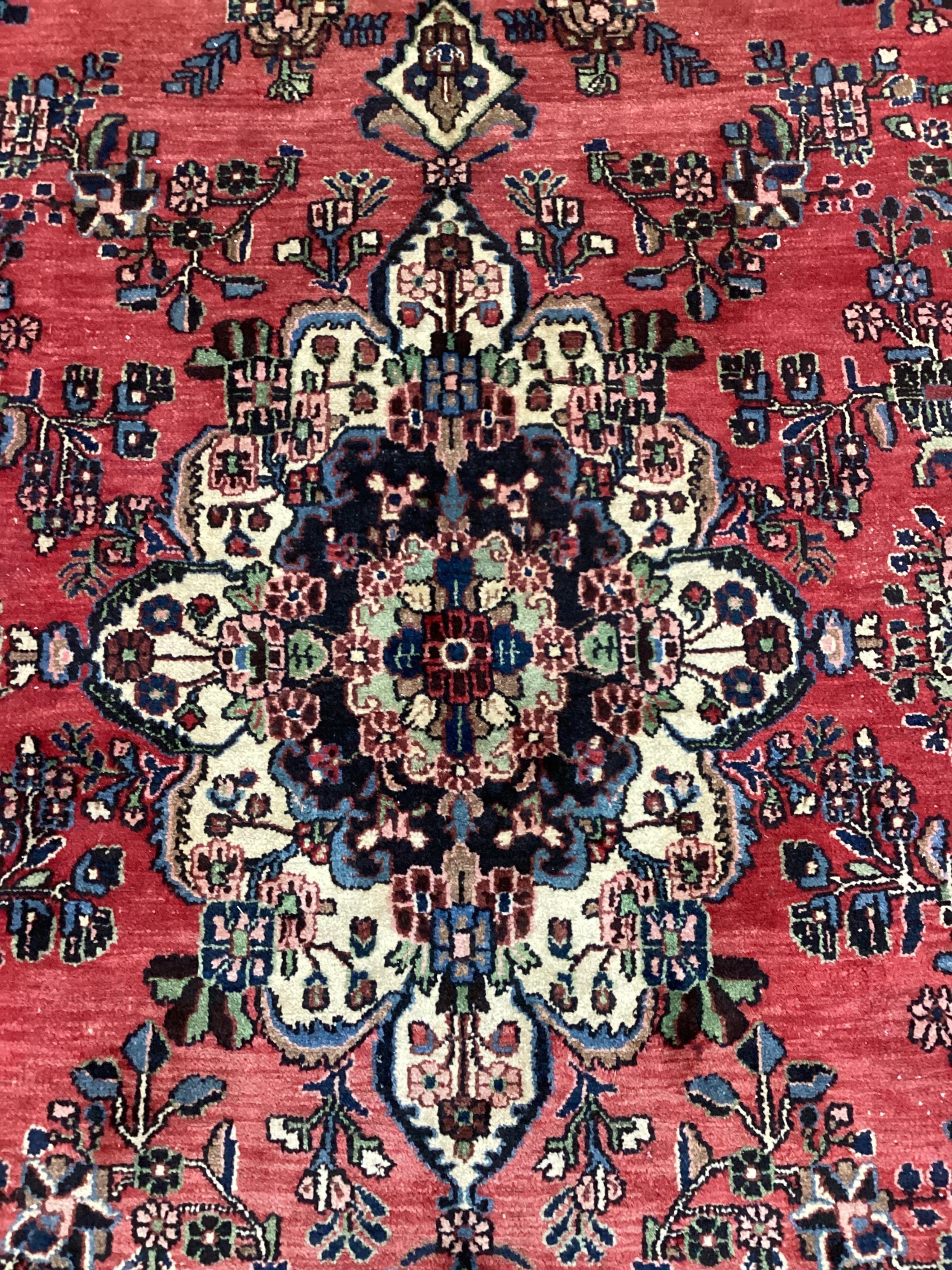 A Hamadan red ground carpet, 475 x 275cm. Condition - a couple of small patches of old moth damage